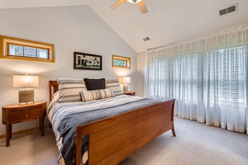 Home offers 5 bedrooms, four spacious upper-level bedrooms and a 5th on the lower level. Primary suite features a spa-like bath. Large spacious windows overlook the wooded back yard and pond.