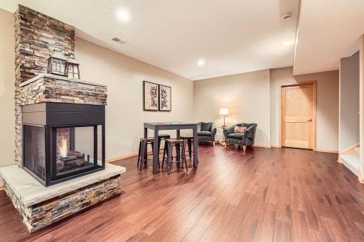 The lower level is a perfect blend of warmth, function, and styleâideal for making memories on game night, or just enjoying a fun movie. Gas fireplace is perfect for cooler weather.