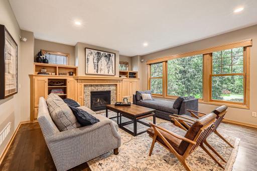This home looks like a model home! Solid maple floors on main level and abundant custom maple cabinets for your storage needs. Large windows let the natural light and nature views pour in.