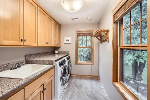 2nd Floor Laundry Room is perfect! Room for the ironing board, extra storage & so much more! Lovely custom cabinets in this room as well!