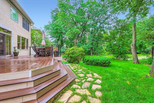 Relax and unwind in this lovely back yard. Maintenance free deck is very large!