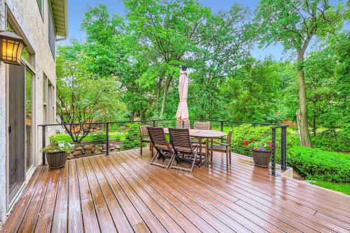 Set on a picturesque wooded lot with tranquil pond views, this beautifully updated residence offers timeless sophistication and modern comfort. Newer maintenance free deck overlooks a gorgeous private setting. Sprinkler system for the lawn too!