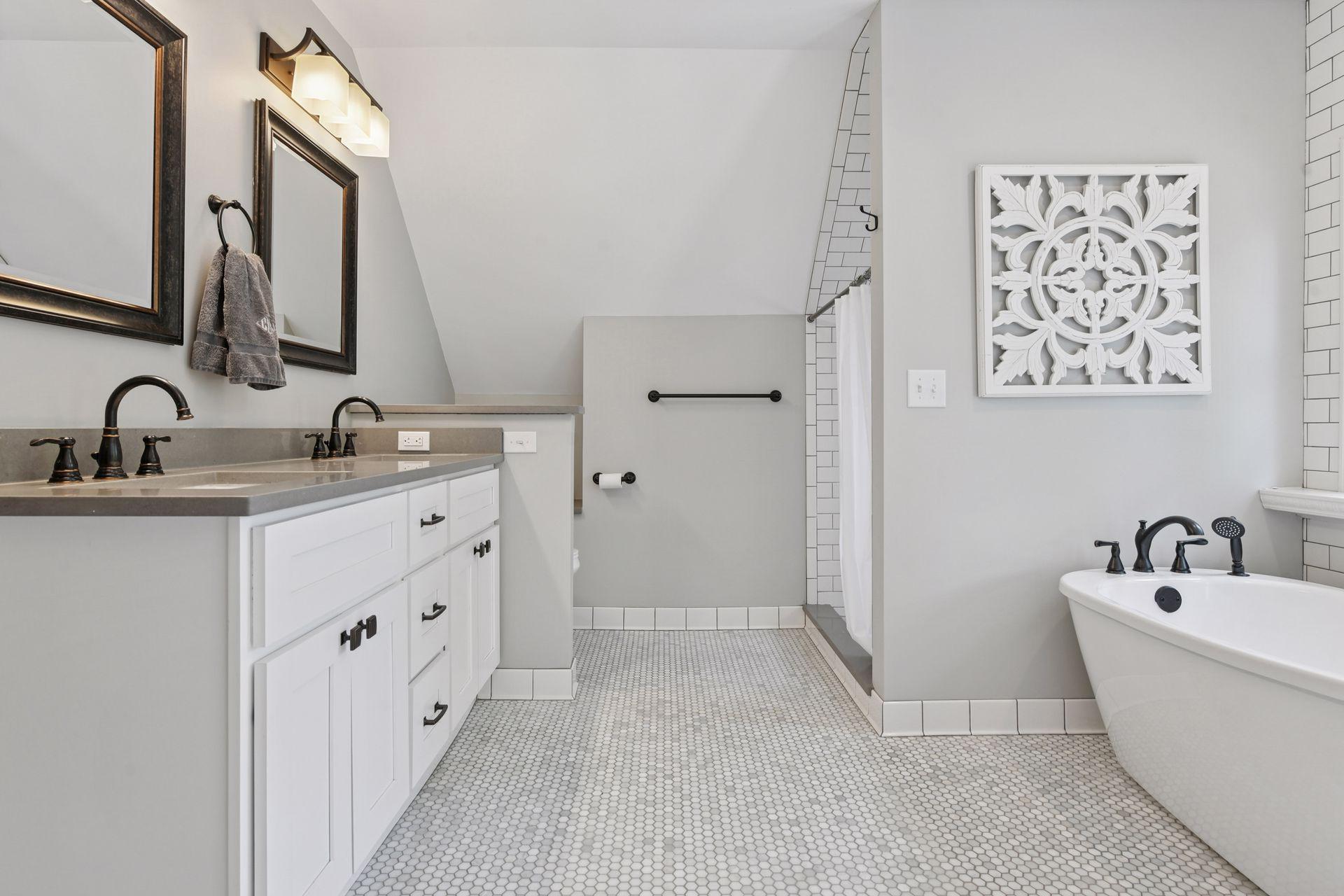 3837 Pleasant Avenue - Primary Suite Bathroom - Double bowl quartz vanity, semi-private commode, large shower and free-standing soaking tub.