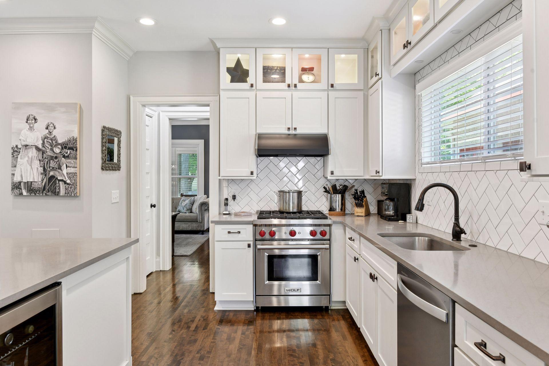 3837 Pleasant Avenue - Gourmet Kitchen - Herringbone subway tile backsplash.