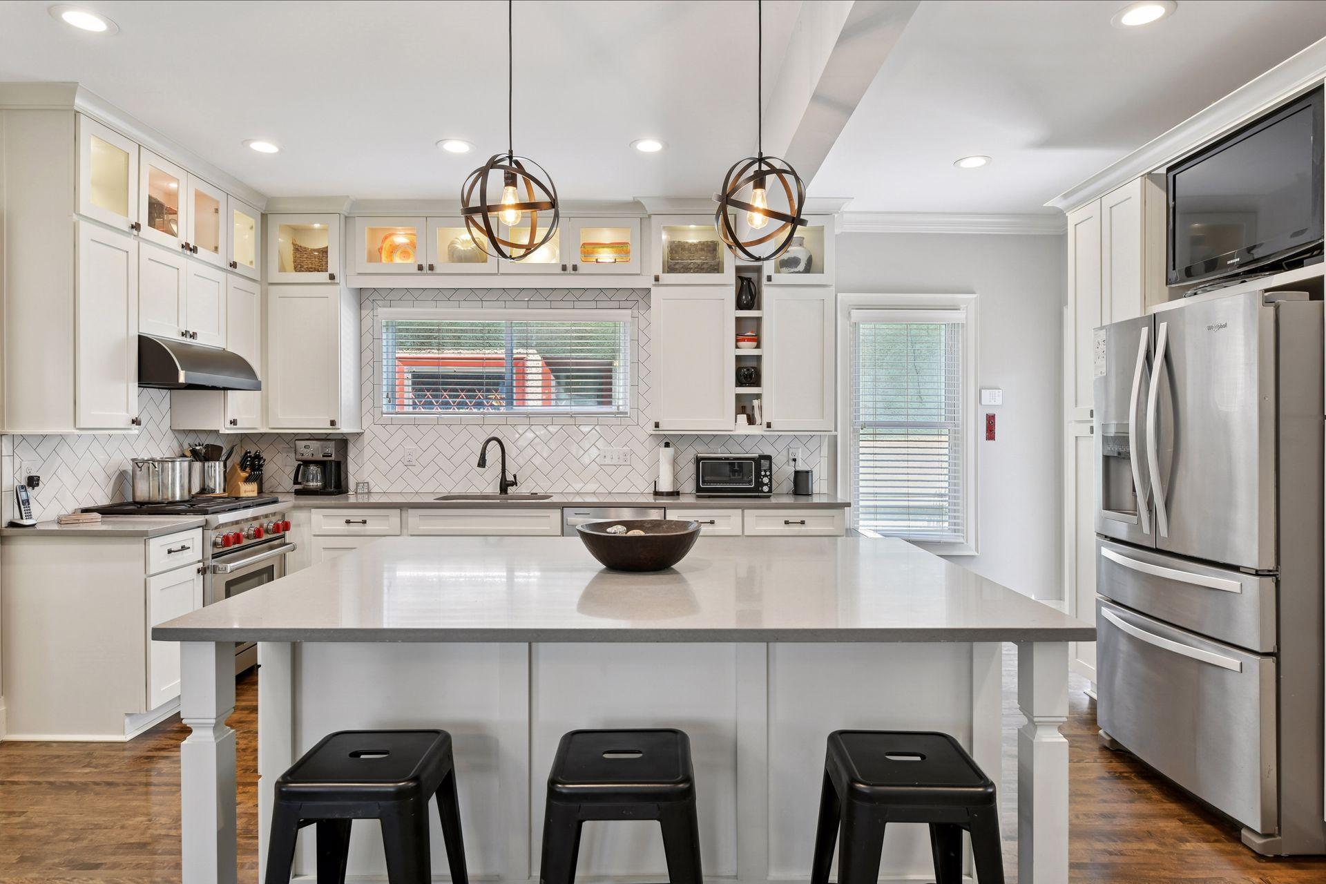 3837 Pleasant Avenue - Wonderful oversized Breakfast Island - Dreamy floor to ceiling painted custom built wood cabinets.