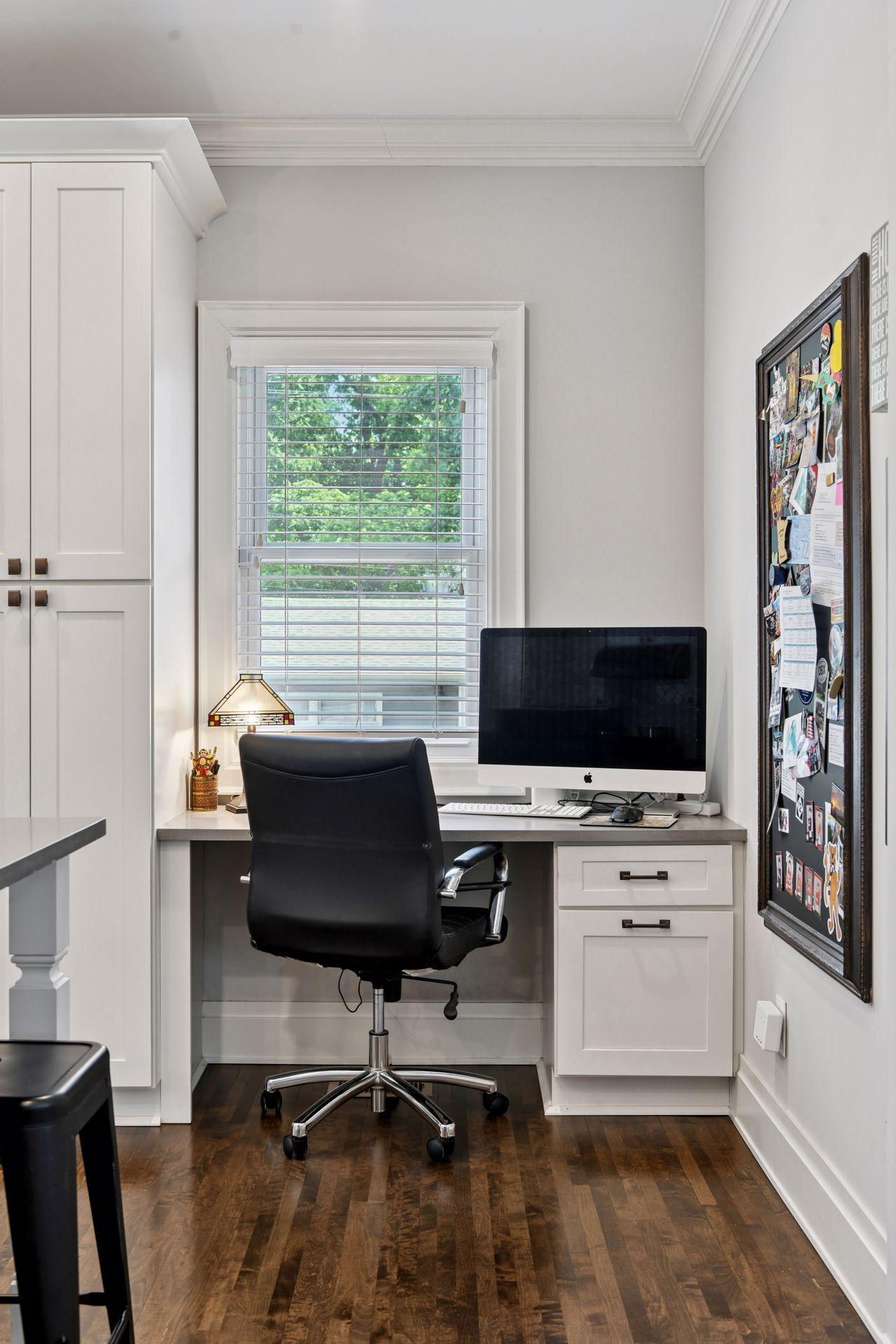 3837 Pleasant Avenue - Home organization won't be such a chore at this desk with a window!