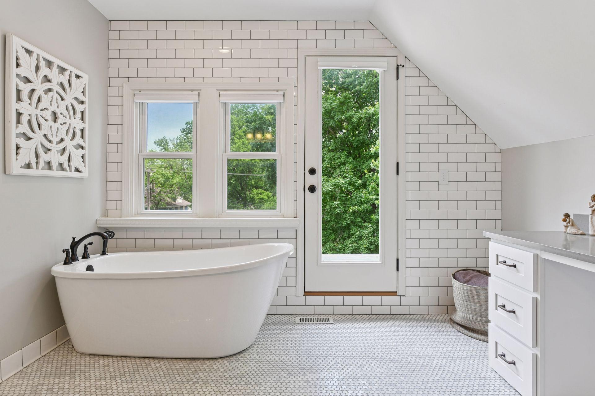3837 Pleasant Avenue - Spa-inspired Primary Bathroom Suite. Soak in the treetops in this bathroom of your dreams!
