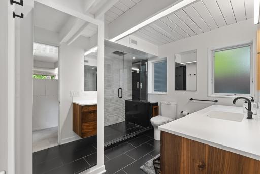 A contemporary bathroom completes the primary suite.