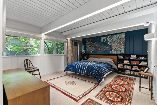 On its own level, the primary suite offers a private and cozy retreat.