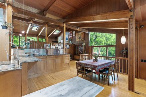 Large swaths of glass and simple elevation changes integrate the home into its surroundings, making you forget you are just minutes from the energy of the city.