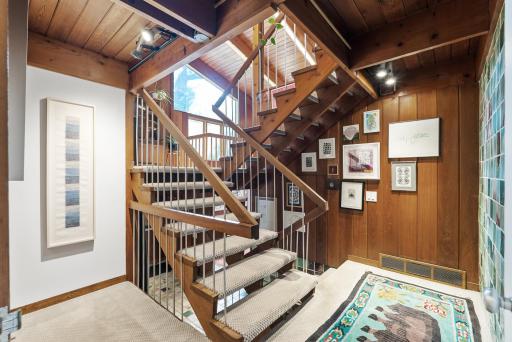 The central staircase acts as the backbone, connecting all five levels of the home.