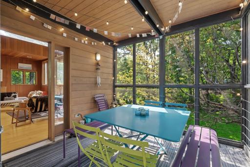 A screened-in porch provides a lovely spot to sit and enjoy a meal while you watch the deer and other wildlife pass through the yard.