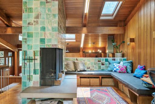 The fireplace seating area is another fantastic feature of this home, and overlooks the kitchen.