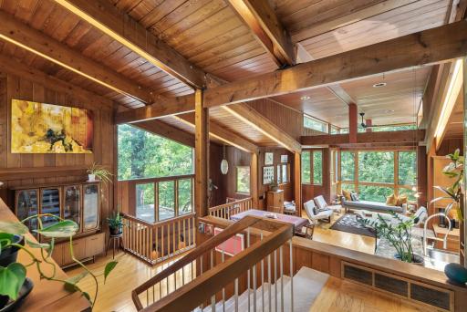 The main living spaces are emblematic of Griffith's characteristic open floor plans and large windows, a nod to the organic architecture movement developing simultaneously.