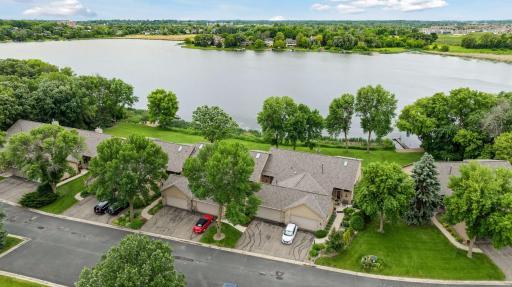 Hard to find main level living with ultimate privacy that backs to lake front on full recreational Burandt Lake! Stunning interior updated throughout.