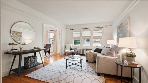 Welcome to this sunny & bright corner unit elevated off street just steps from Bde Maka Ska. Photo taken when listing was staged.