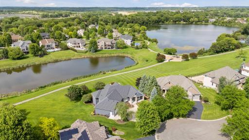 Nestled on a quiet cul-de-sac in the heart of demand Watermark, this custom rambler enjoys uninterrupted views of the neighborhood ponds and wide open green spaces.