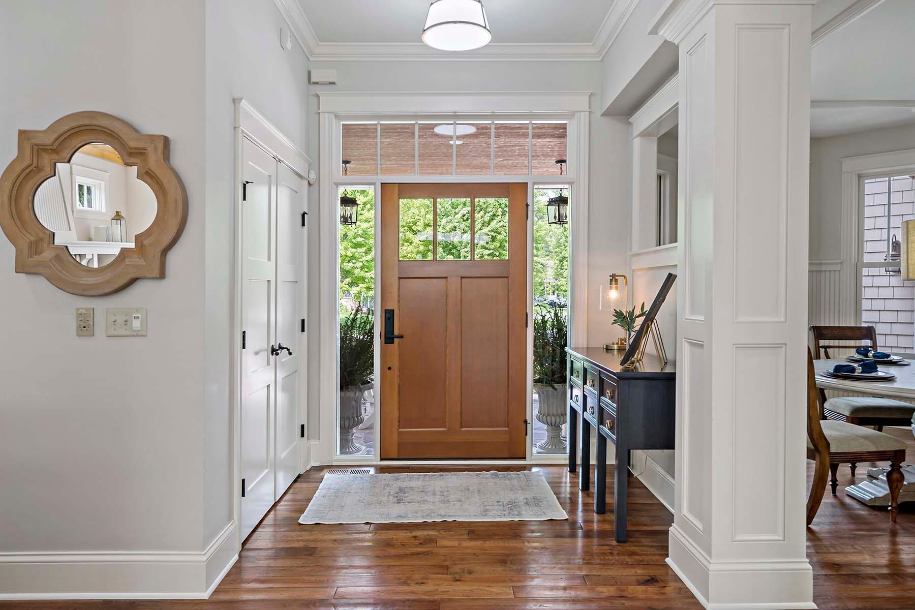 Custom matching woodwork throughout including hand-scraped walnut floors