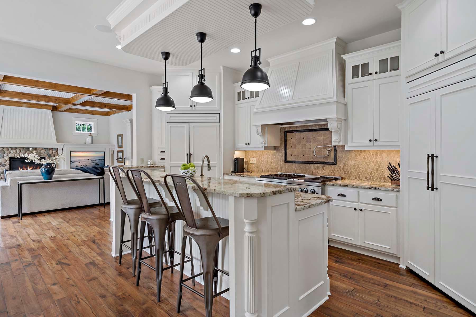 A chef's kitchen including two large refrigerators