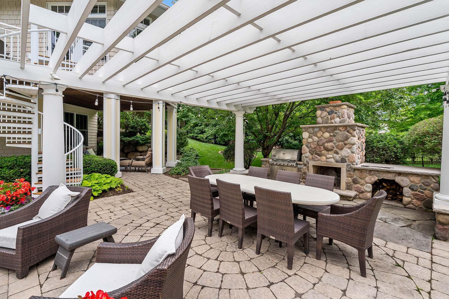 Outdoor woodburning stone fireplace with a gas grill