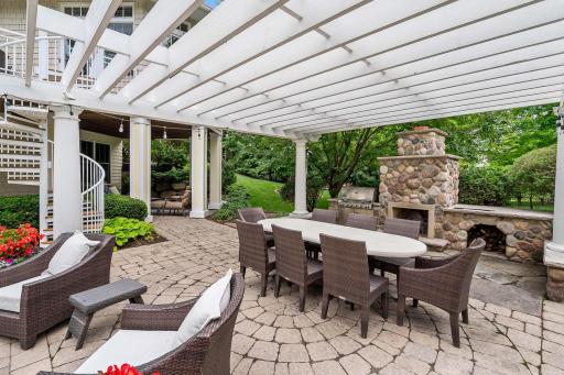 Outdoor woodburning stone fireplace with a gas grill