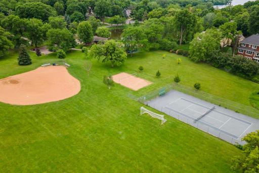 Manor Park offers tennis, beach volleyball, baseball/softball, a playground, bathrooms/warming house, skating area in the winter, and more.
