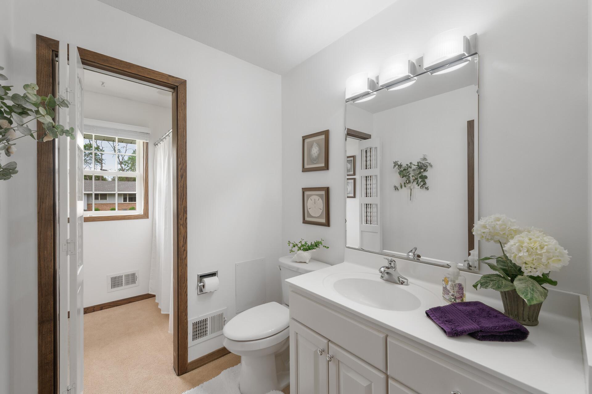 Bath has convenient separation of sink and shower
