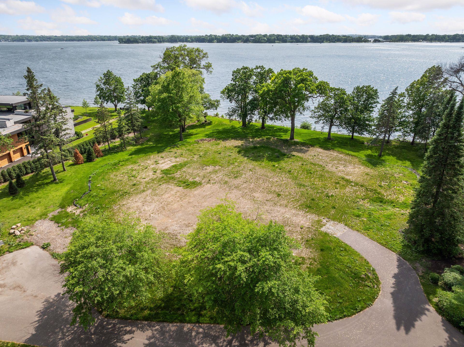 Here, scale and setting converge to offer a premier canvas for your modern lake home.