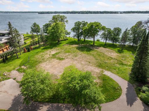 Here, scale and setting converge to offer a premier canvas for your modern lake home.