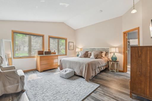 Upper level primary suite is your own little sanctuary with vaulted ceilings & beautiful natural light