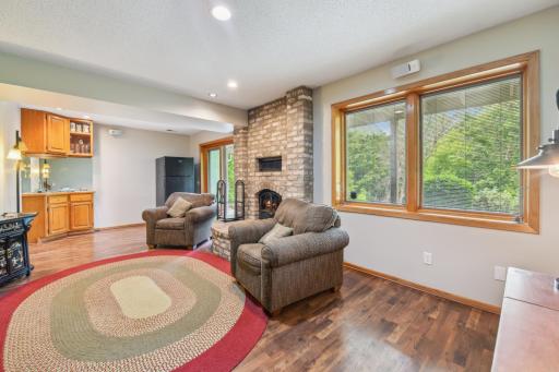 Lower level walkout family room with a wet bar and wood fireplace