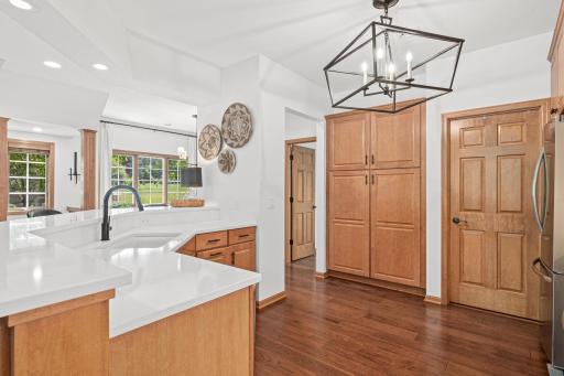 Laundry room with sink off kitchen with large pantry.
