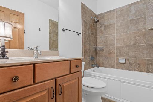 Ceramic tile floors and shower with extra deep tub.