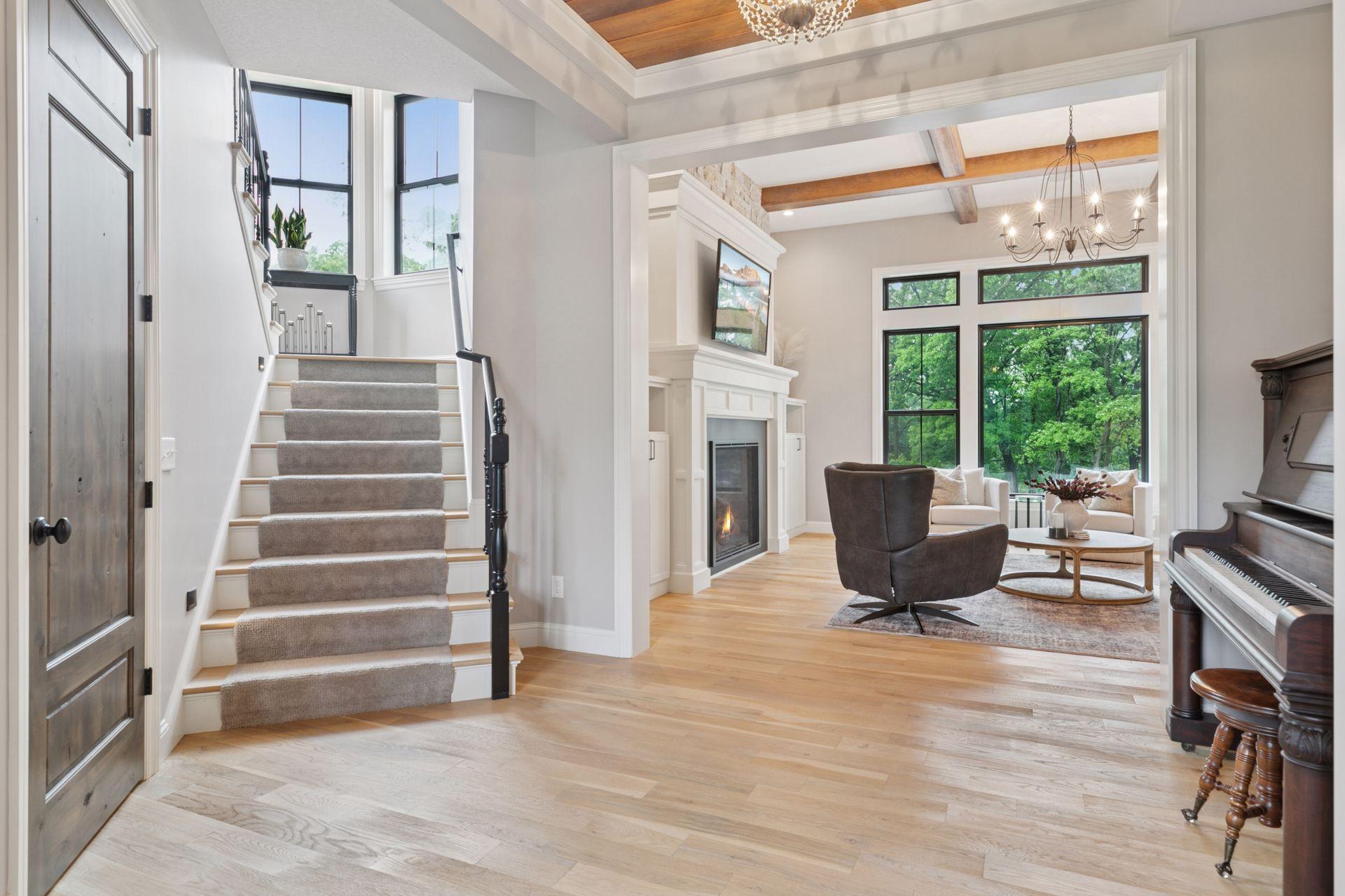 Open-concept layout with sightlines from the entry to the living space, highlighted by hardwood floors and natural light throughout.
