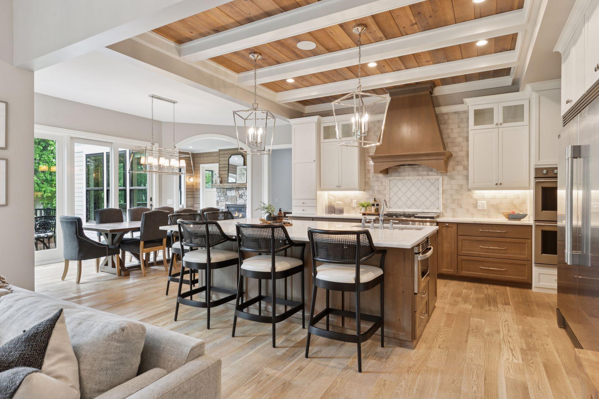 Spacious layout with designer kitchen flowing into a bright dining area, complete with sliding glass doors and views of the backyard.