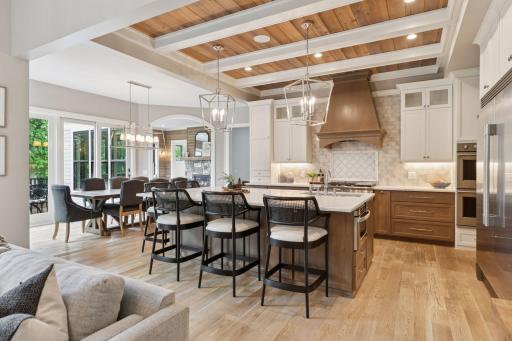 Spacious layout with designer kitchen flowing into a bright dining area, complete with sliding glass doors and views of the backyard.