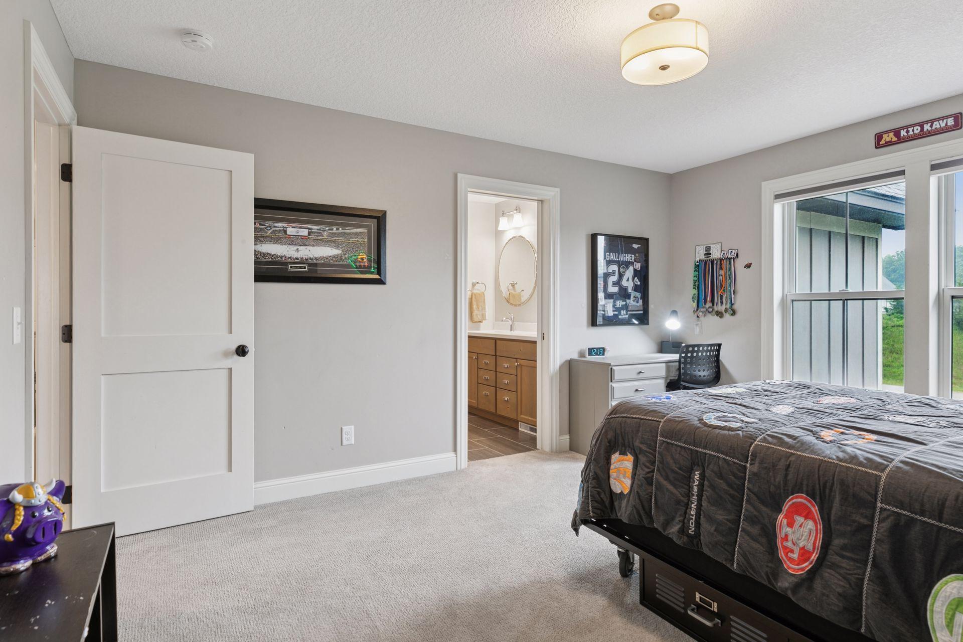 Secondary bedroom with Jack-and-Jill bathroom and space for studying or relaxing.