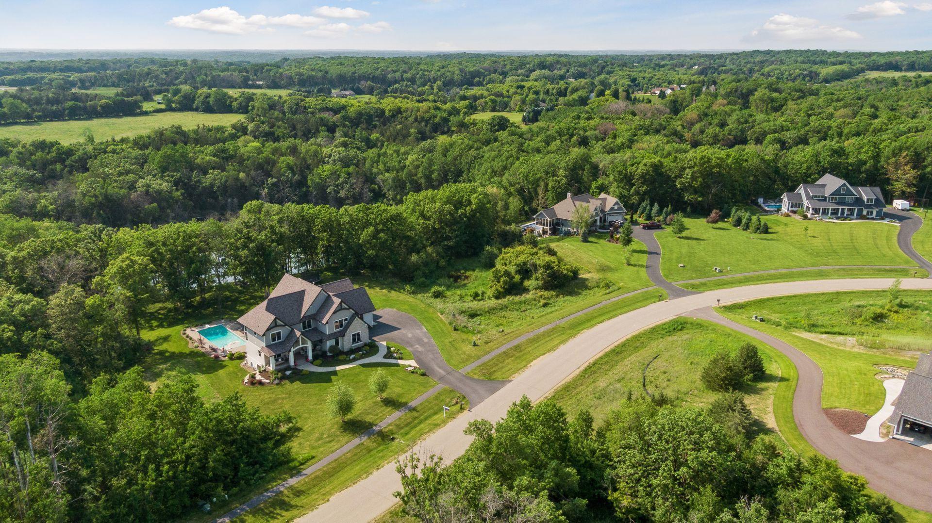 Gorgeous aerial of homesite in the Orchards of St. Croix—highlighting the home's private wooded lot, sparkling pool, and upscale neighborhood setting.