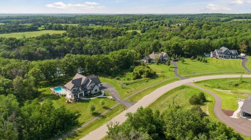 Gorgeous aerial of homesite in the Orchards of St. Croixâhighlighting the home's private wooded lot, sparkling pool, and upscale neighborhood setting.