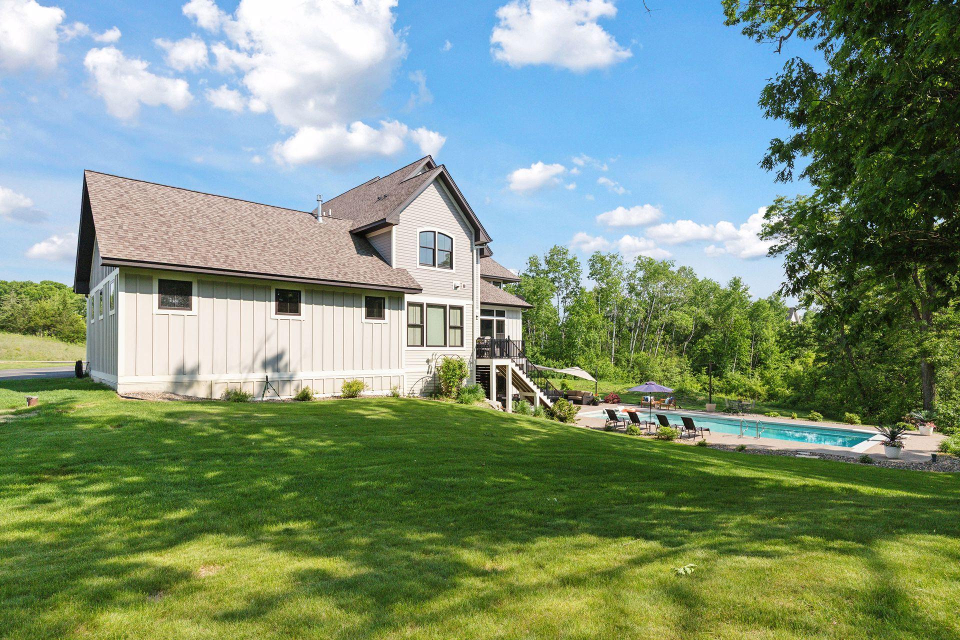 Expansive backyard meets serene woodland views. Enjoy the privacy of mature trees, pristine landscaping, and a luxurious in-ground pool—perfect for entertaining or unwinding in a resort-style setting.