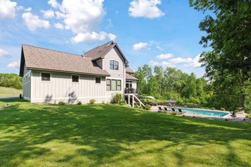 Expansive backyard meets serene woodland views. Enjoy the privacy of mature trees, pristine landscaping, and a luxurious in-ground poolâperfect for entertaining or unwinding in a resort-style setting.