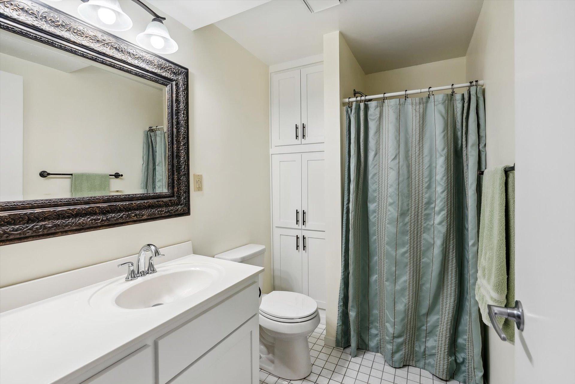 3/4 bathroom in the basement with ample storage.
