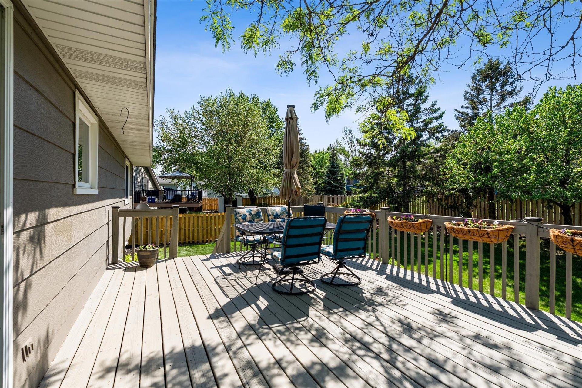 Mature trees provide some shade on the deck.