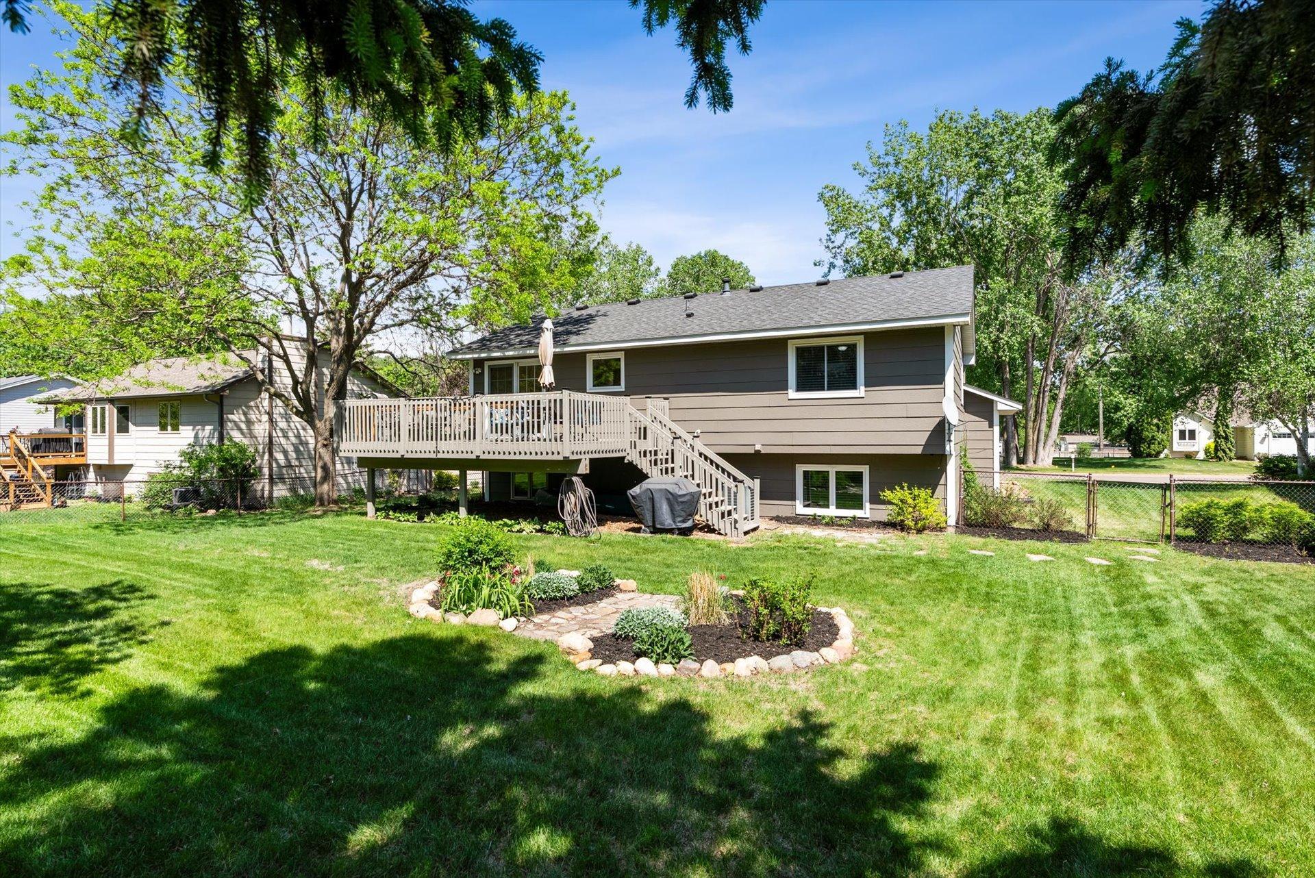 Large deck in the fully fenced back yard.