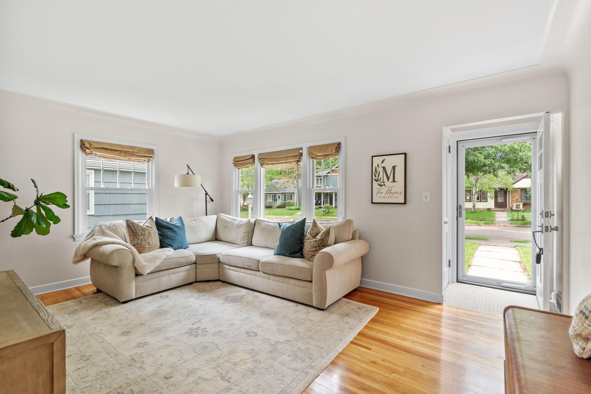 Hardwood floors are located in the living room, dining room, and both bedrooms on the main floor.