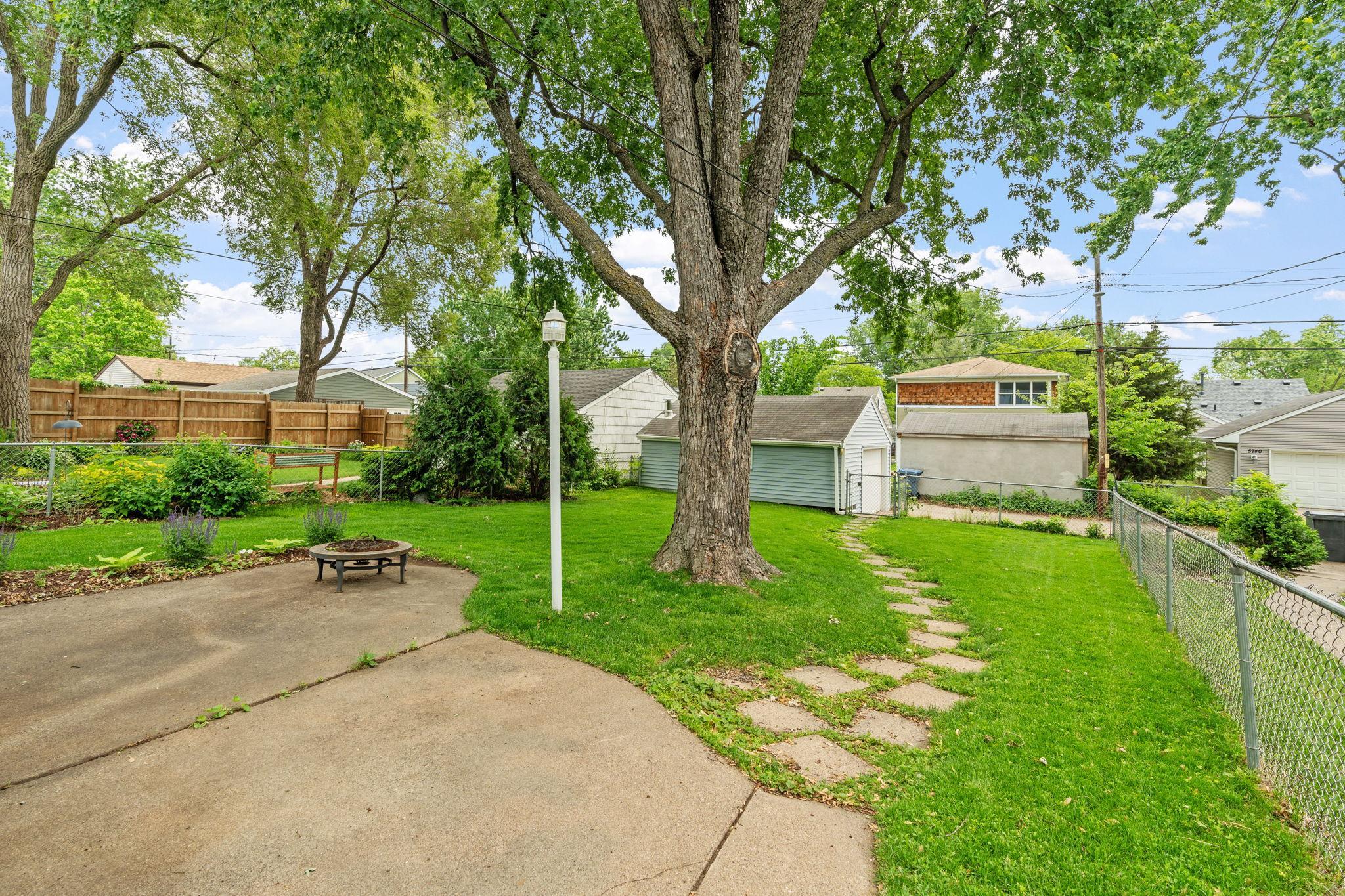 Enjoy summertime bonfires and grilling on the back yard patio.