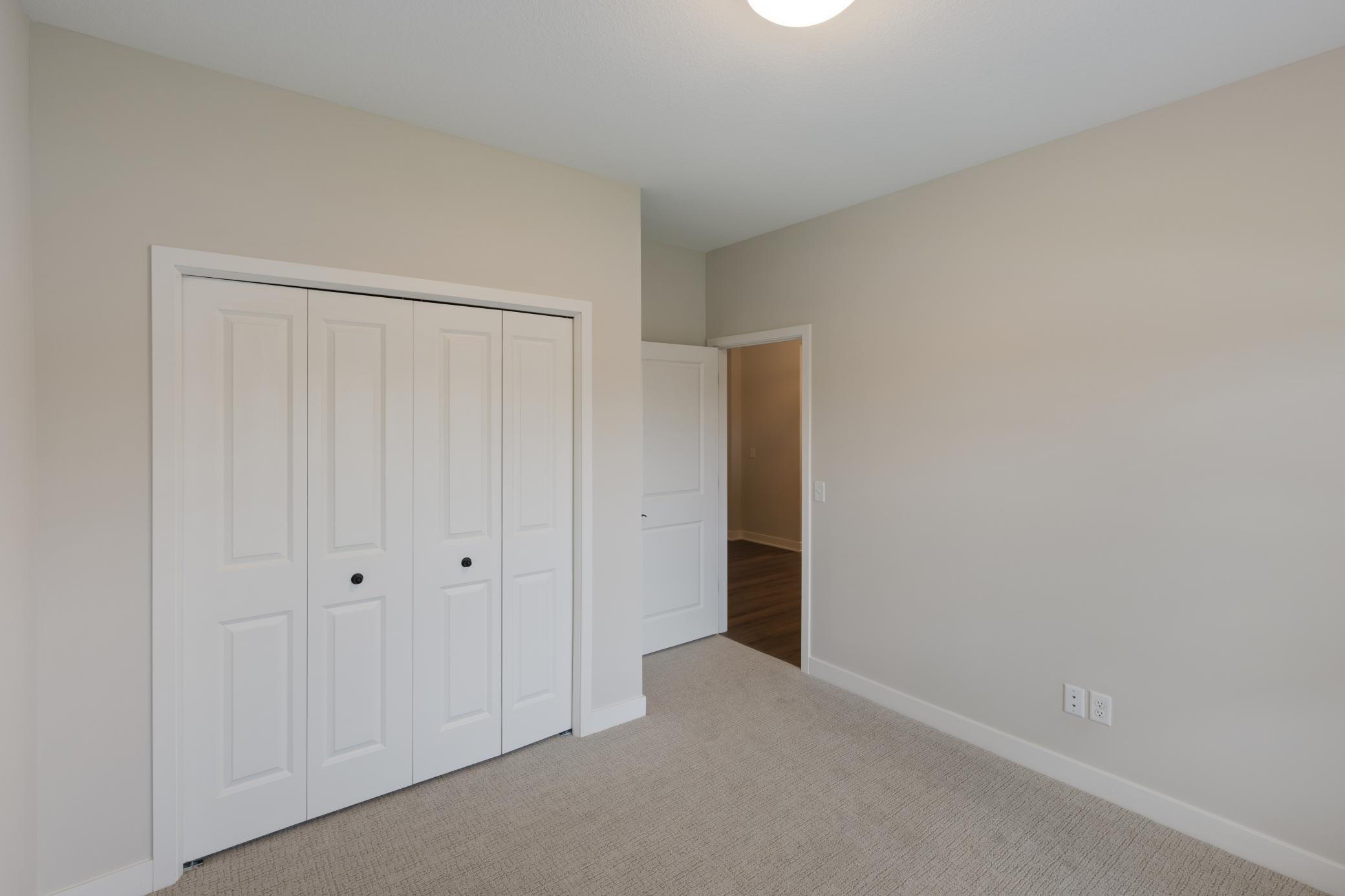 Situated at the front of the home, the second bedroom offers a private and cozy retreat. Measuring 13x11, this room provides ample space for various uses, whether as a guest room, home office, or children's room. *colors and finishes may vary.