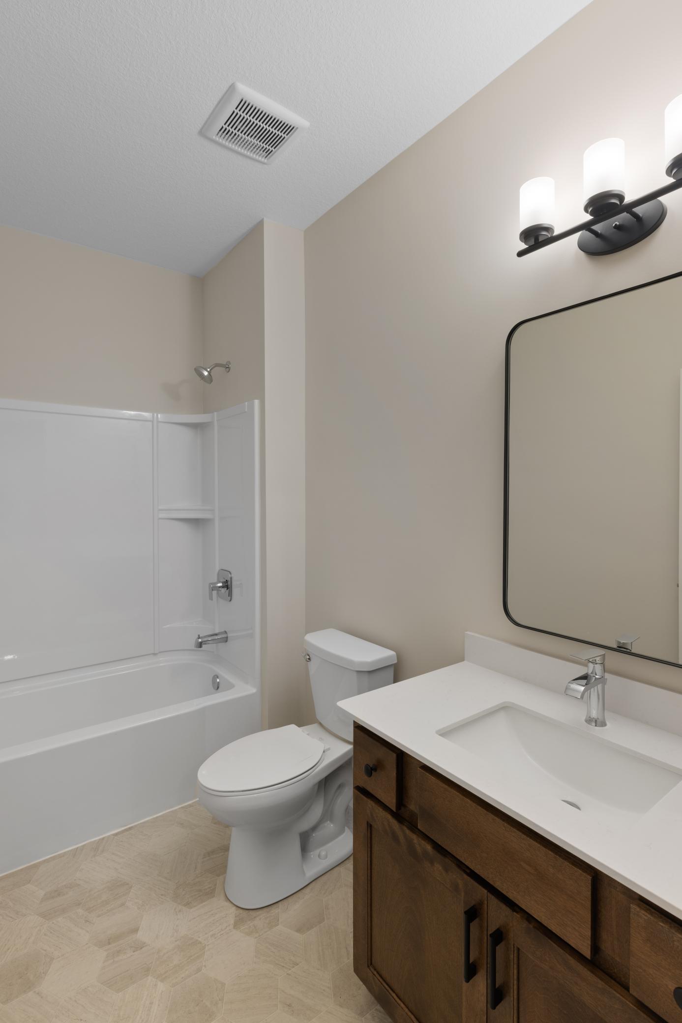 Conveniently located near the second bedroom, the second bathroom offers easy access and functionality. Featuring modern fixtures and finishes, this bathroom is perfect for guests or family members. *Interior colors and finishes may vary.