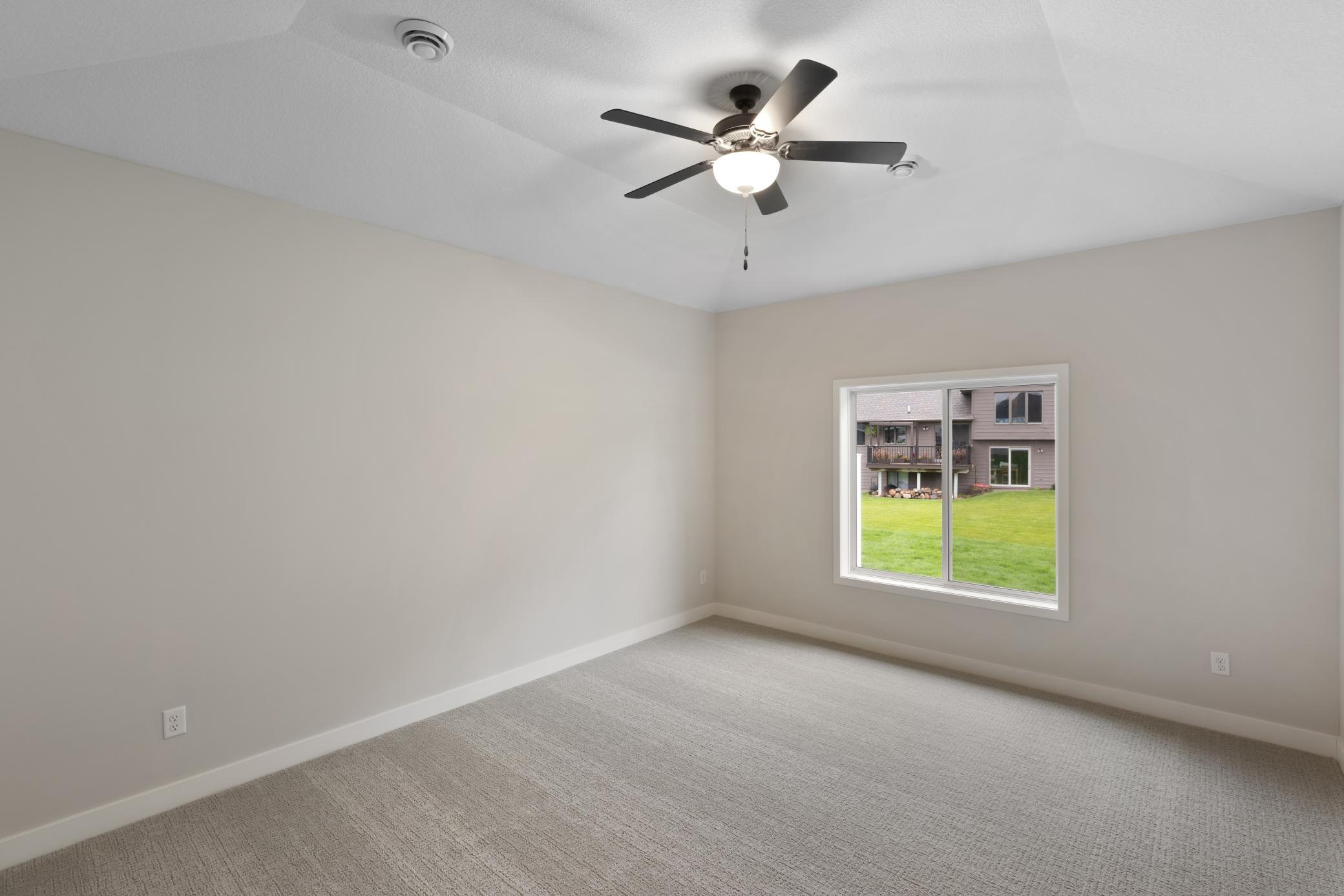 Generously sized primary bedroom (15x13) offering a peaceful retreat with plenty of space for relaxation. Features ample natural light and room for a king-size bed and additional furnishings. *Interior colors and finishes may vary.