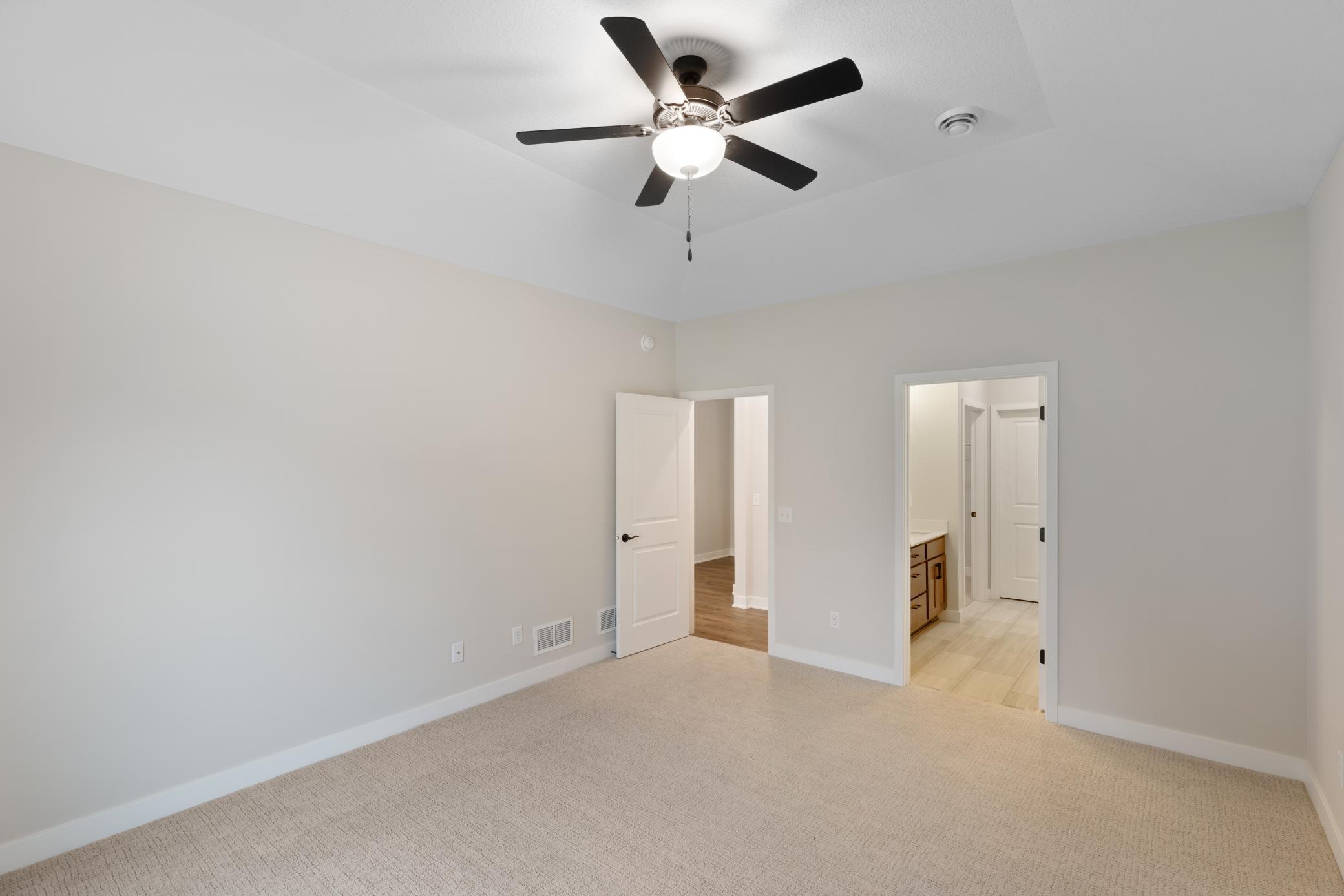 Generously sized primary bedroom (15x13) offering a peaceful retreat with plenty of space for relaxation. Features ample natural light and room for a king-size bed and additional furnishings. *Interior colors and finishes may vary.